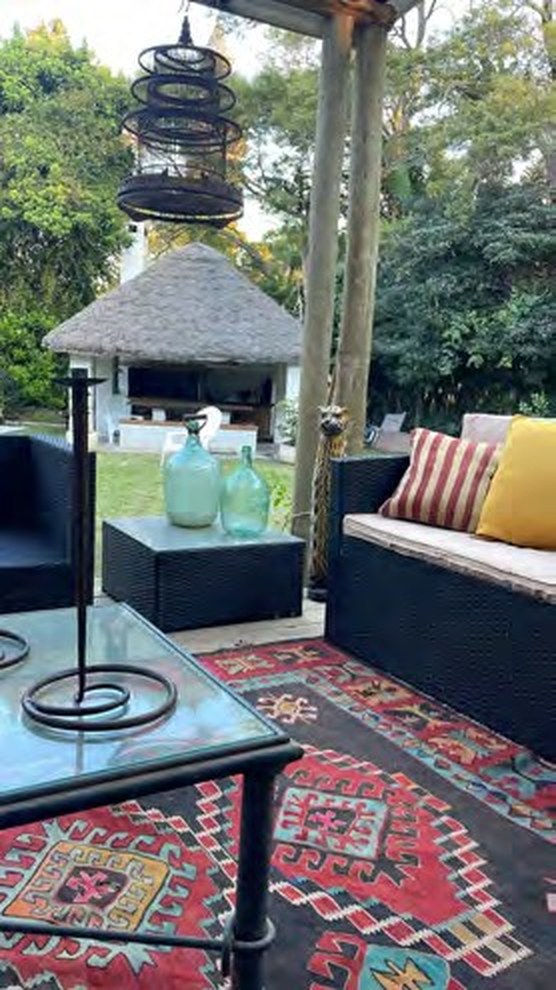 Outdoor lounge with deep sofas under the trees