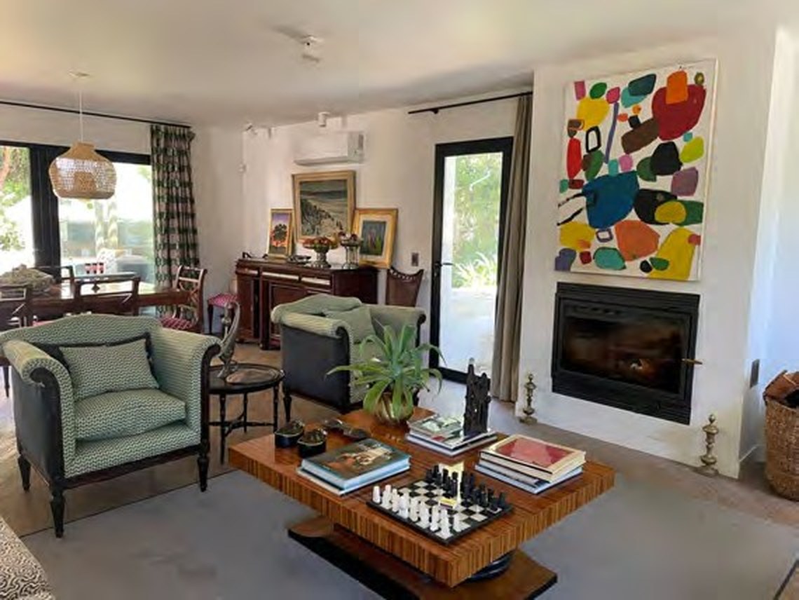 Living room with fireplace and vintage seating